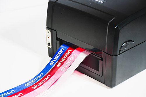 Leden Ribbon Printer with Shecan logo sample prints